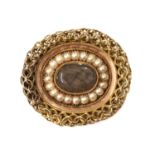 A gold split pearl oval memorial brooch, c.1810-1820,