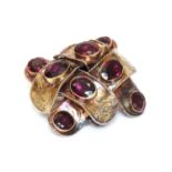 A Victorian garnet set ribbon style knot brooch,