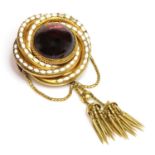 A Victorian gold garnet and enamel brooch,