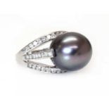 A white gold single stone cultured Tahitian pearl ring,