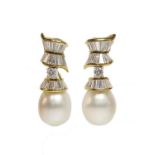 A pair of cultured South Sea pearl and diamond drop earrings,