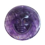 An unmounted circular carved amethyst cameo,