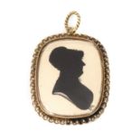 A Regency gold mounted painted silhouette pendant,