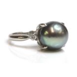 A cultured Tahitian pearl and diamond ring,