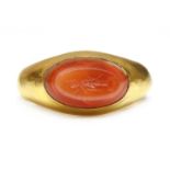 A Roman hollow gold hardstone intaglio ring,