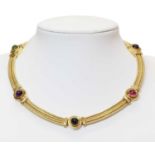 An 18ct gold four row gold cable, tourmaline and amethyst collar, c.1990,