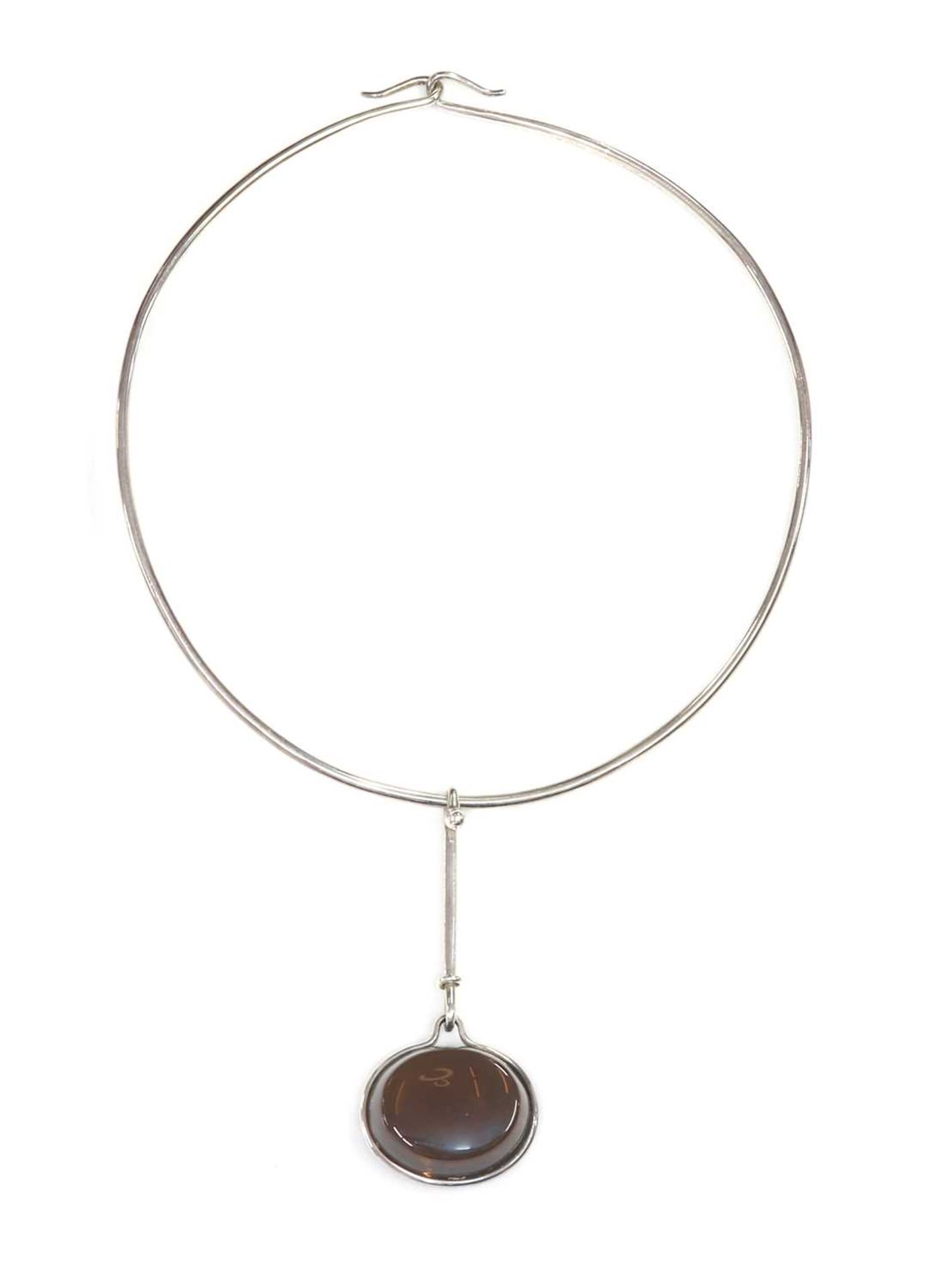 A sterling silver smoky quartz 'Dew Drop' pendant, by Georg Jensen,