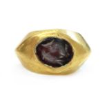 A Roman hollow gold hardstone intaglio ring,