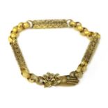 A Regency gold long chain,