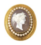 A Victorian gold archaeological revival, Etruscan style, shell cameo and split pearl brooch, c.1870,