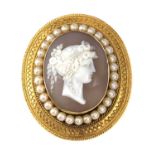 A Victorian gold archaeological revival, Etruscan style, shell cameo and split pearl brooch, c.1870,