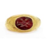 A Roman hollow gold hardstone intaglio ring,