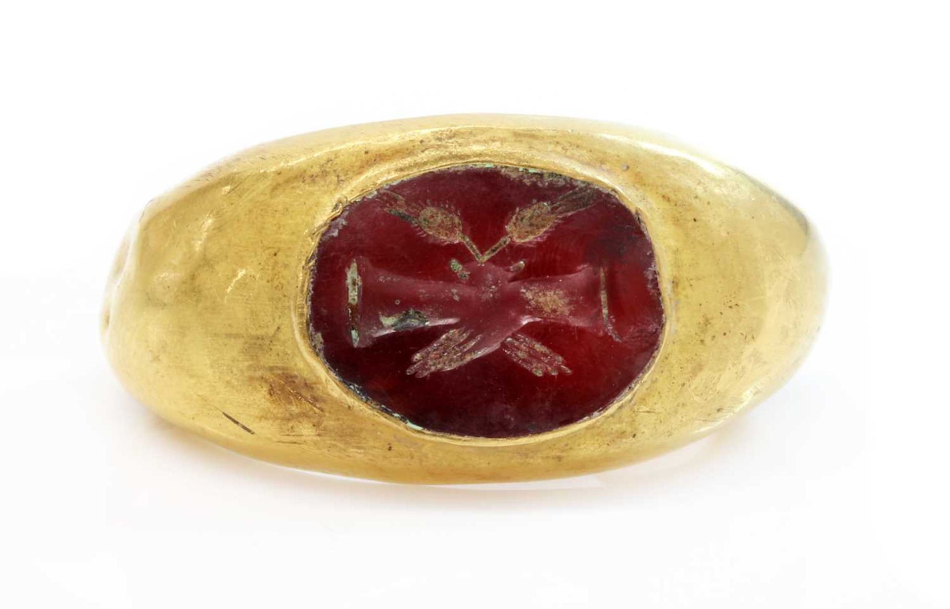 A Roman hollow gold hardstone intaglio ring,