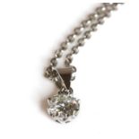 A white gold single stone diamond pendant,