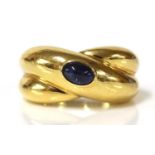 A single stone sapphire crossover band ring, by Cartier, c.1992,