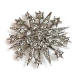 A 9ct white gold Victorian style diamond set star brooch/pendant,