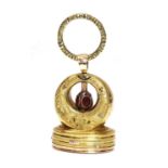 A Regency gold and enamel musical seal/fob,