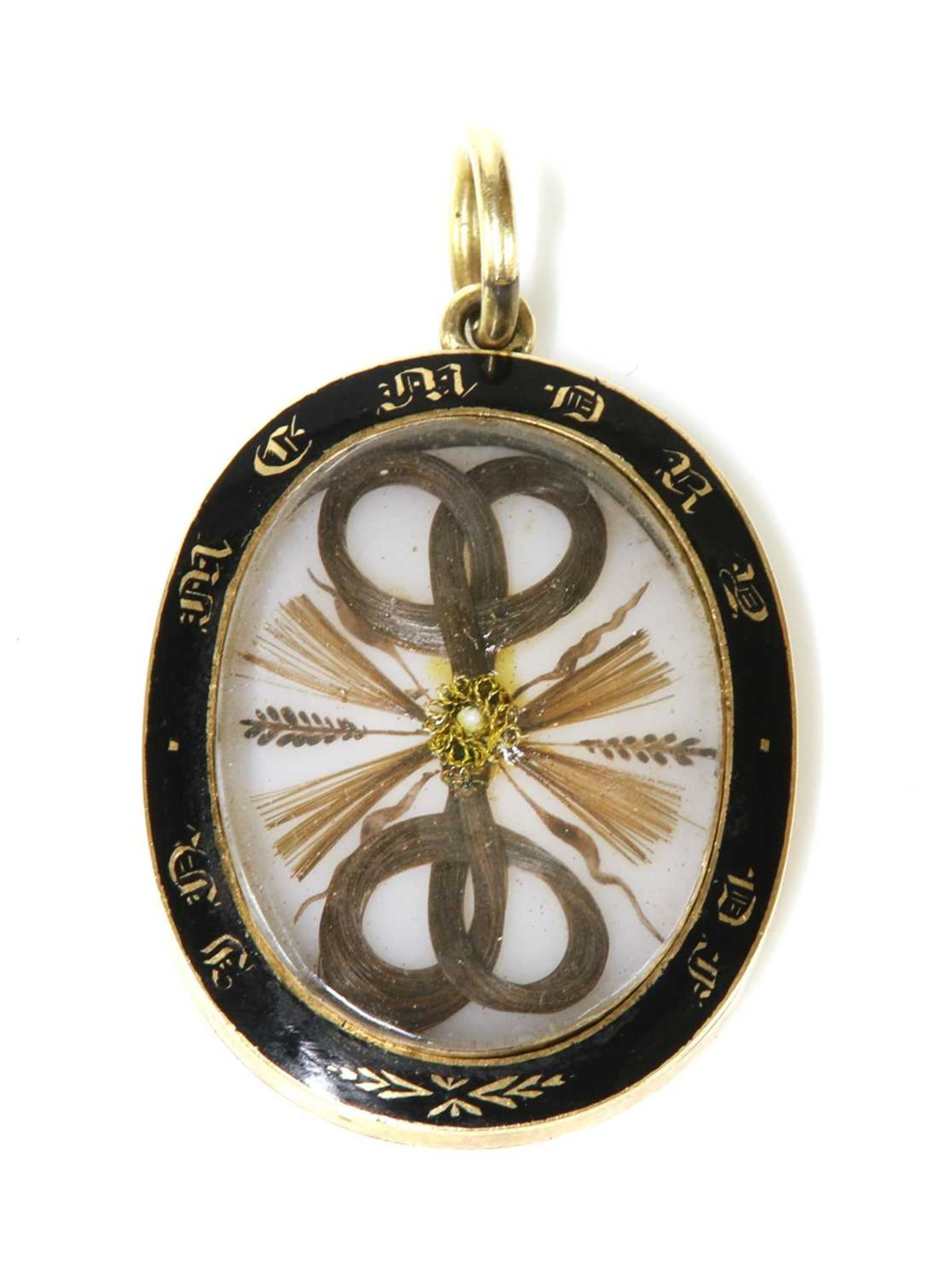 A Victorian gold glazed memorial locket,