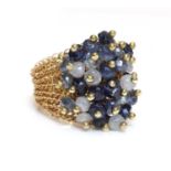An 18ct gold sapphire cluster ring, by Rina Tairo,