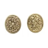 A pair of oval repoussé earrings,