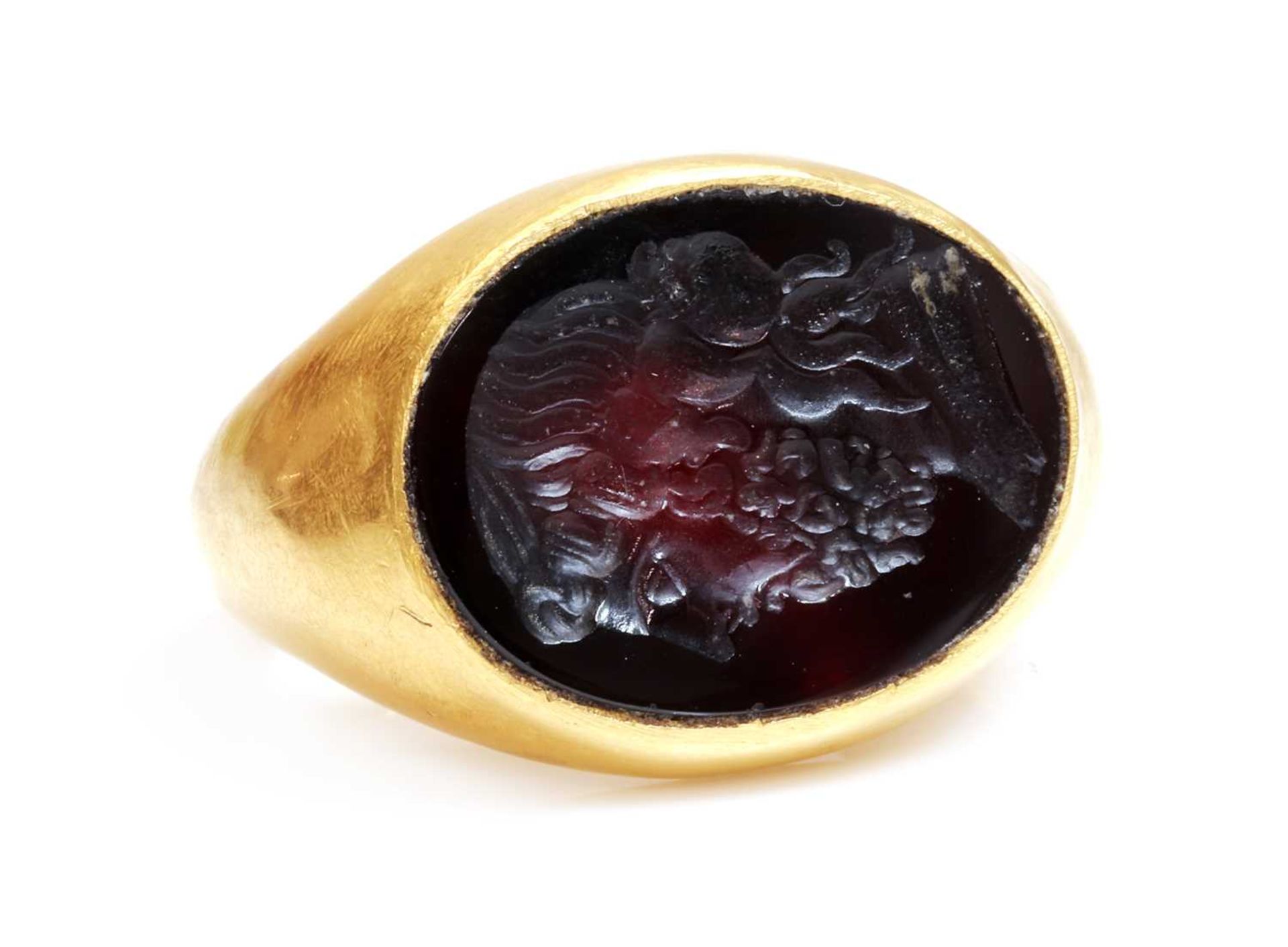 A Roman hollow gold hardstone intaglio ring,