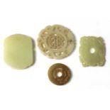 A collection of four Chinese jade pendants,