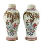 A pair of Chinese export famille rose vases,