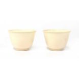 A pair of Chinese ivory cups,