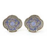 A pair of Chinese export Canton painted enamel saucers,