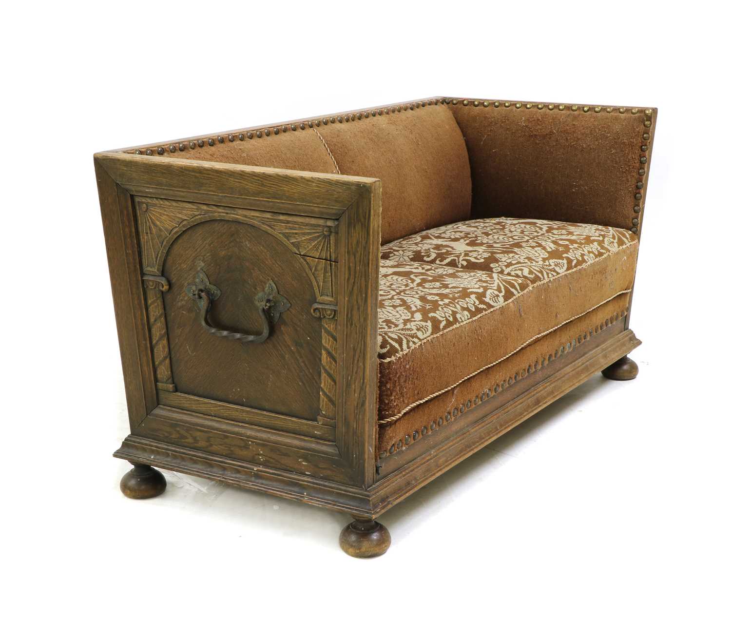 A Continental oak trunk sofa,