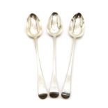 A group of three silver basting spoons,