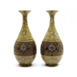 A pair of Doulton stoneware vases,