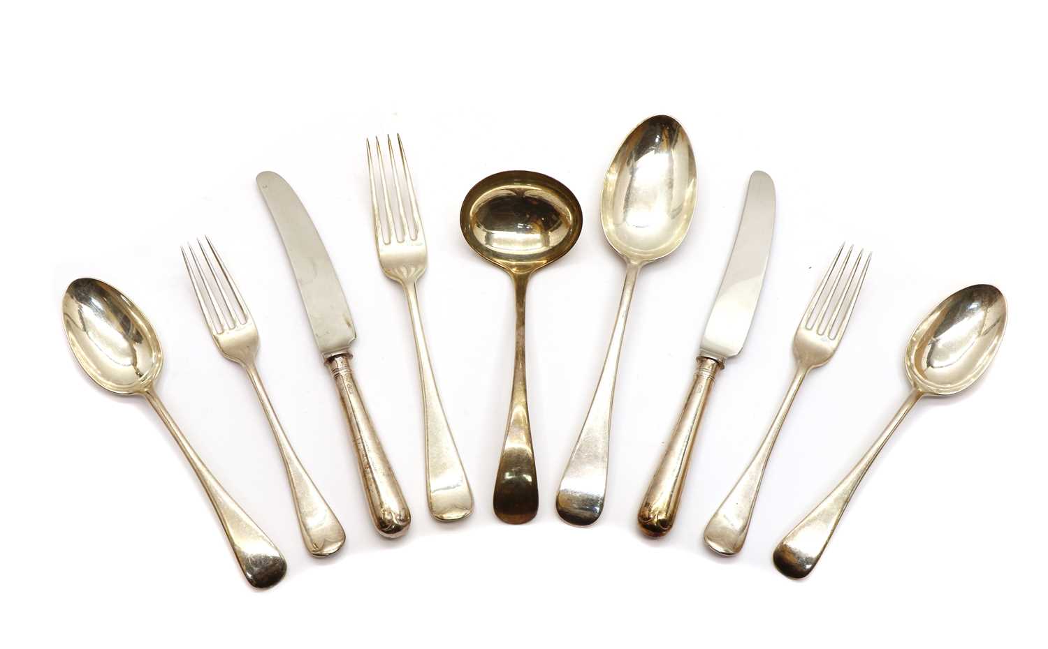An eight place setting of Victorian Old English pattern silver flatware,