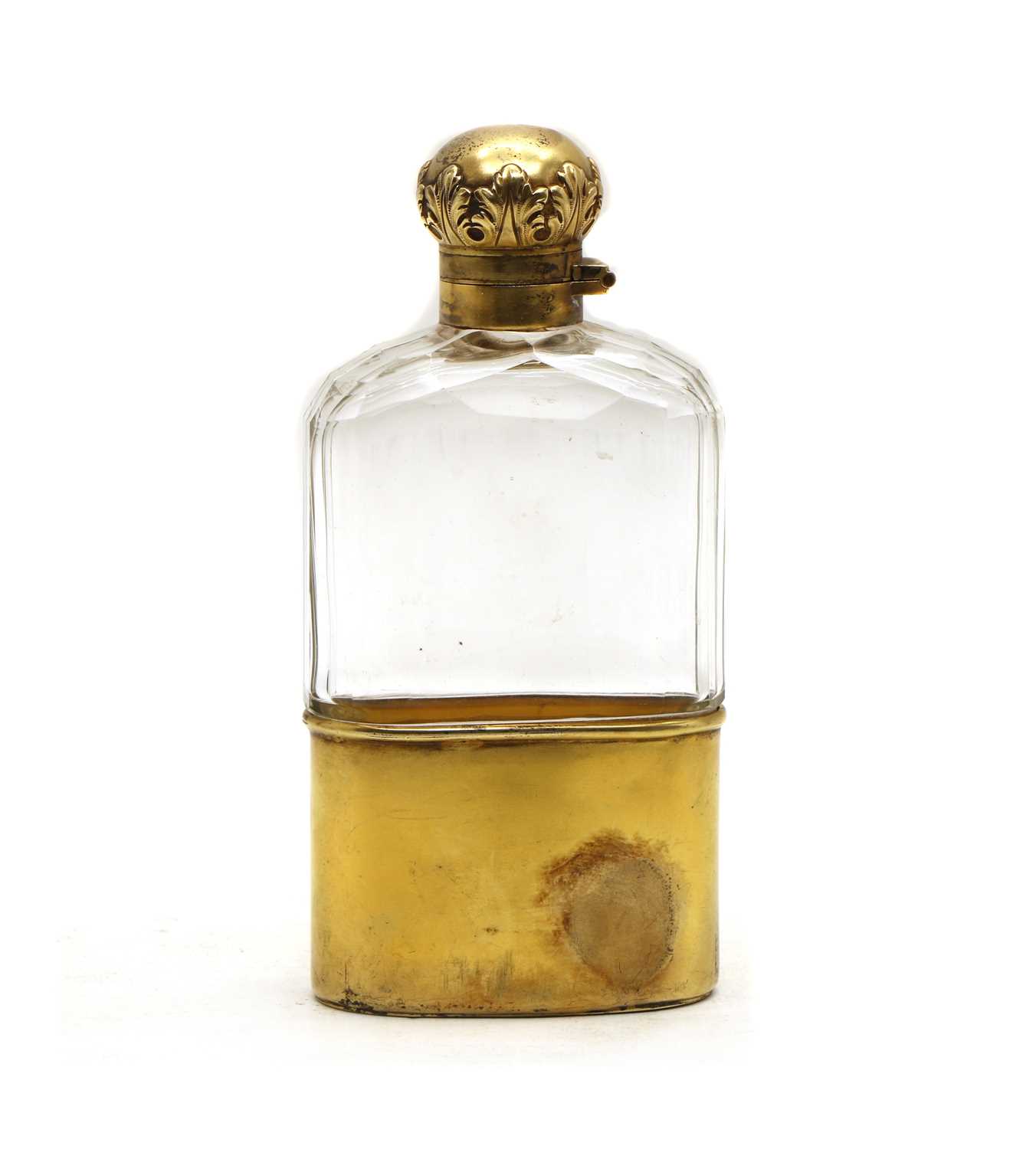 A late Victorian silver-gilt and clear glass hip flask