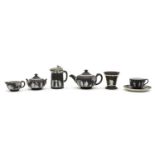 A collection of black Wedgwood jasperware items,