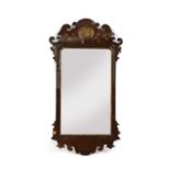 A George II walnut and parcel-gilt mirror,