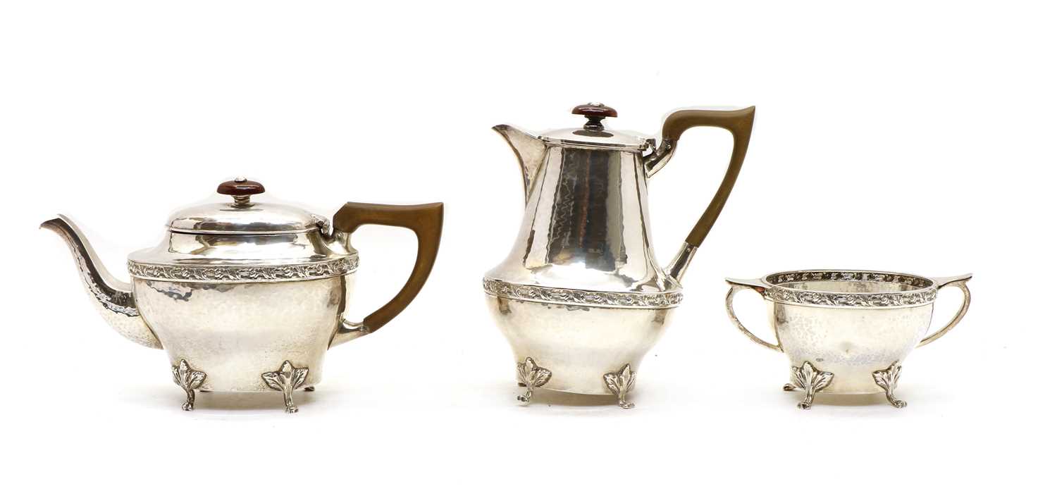 A three piece silver tea service