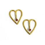 A pair of gold ruby set bow tie clips,