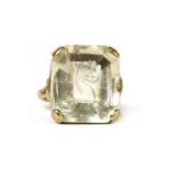 A gold intaglio engraved smoky quartz ring,