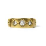 A Victorian 22ct gold three stone diamond ring,