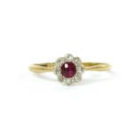 A gold ruby and diamond cluster ring,