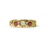 A gold diamond and ruby three stone ring,