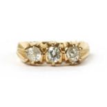 A gold three stone diamond ring,