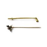 A gold and silver, diamond, ruby and cat's eye quartz bee stick pin,