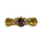 A gold amethyst and citrine brooch,