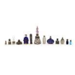 A collection of white metal mounted scent bottles,