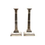 A pair of George III silver candlesticks