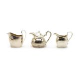 A George III silver cream jug with ivory insulators,