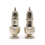 A pair of George II silver pepper pots,