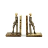 A pair of bookends in the style of Josef Lorenzl,